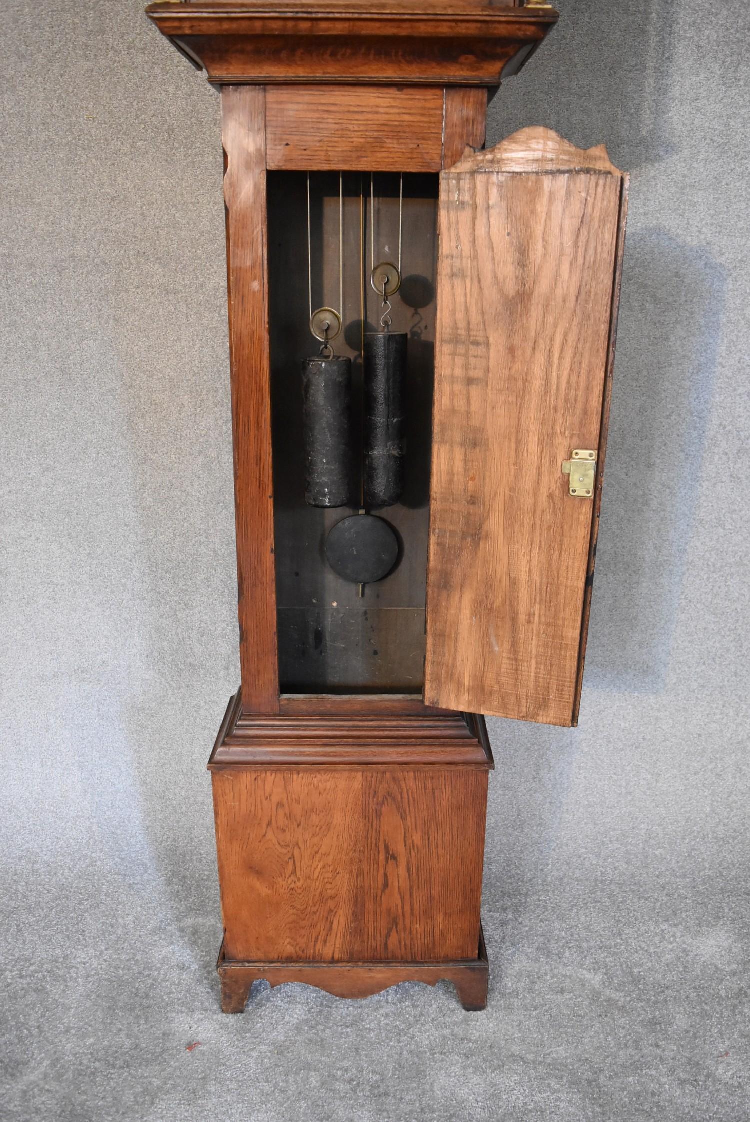 A 19th century oak cased eight day longcase clock with brass dial, has weights and pendulum. H.230 x - Image 3 of 4