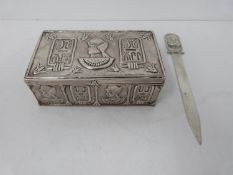 A white metal Egyptian box and pharaoh head White metal letter opener. The box has a repousse design