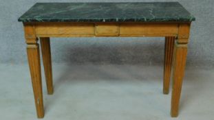 A late 19th century oak marble topped console table raised on fluted square tapering supports. H.