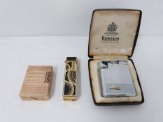 A DuPont rose gold plated vintage lighter and two others. Colibri and Ronson. Largest 6.5cm.