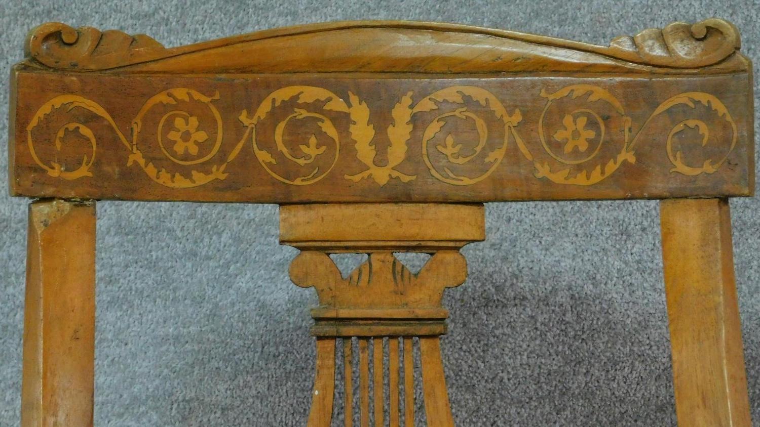 A set of four 19th century Continental walnut and satinwood inlaid chairs, lyre shaped backs on - Image 4 of 12