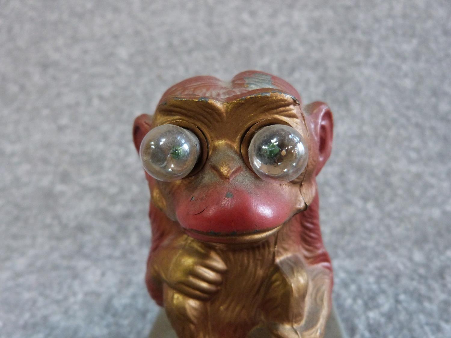 A vintage brass singing decanter and a painted monkey tin plate light. Sings Little Brown Jug. H - Image 11 of 11