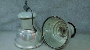 A pair of large vintage industrial spotlights in metal cases. H.80 W.60cm