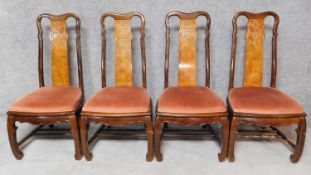 A set of four teak dining chairs with Chinese character motifs to back splat. H.105cm