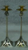 A pair of vintage Art Nouveau style metal candle sticks. H.37cm