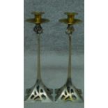 A pair of vintage Art Nouveau style metal candle sticks. H.37cm