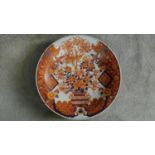 A large Chinese/Japanese hand painted Imari charger with floral and phoenix motifs. Six character