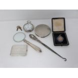 A collection of silver items including a silver pocket watch, antique silver compact, silver