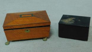 A Japanese black metal jewellery box with raised floral and insect design and a regency satinwood