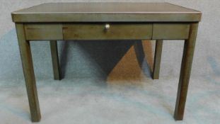 A vintage industrial style metal desk with central drawer and rounded supports. H.78 W.112 D.75cm