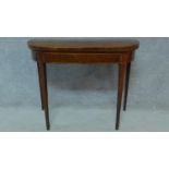 A Georgian mahogany card table raised on tapering square legs. H.73 W.92 D.90cm