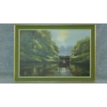 A framed oil on canvas depicting a house by an old water dam in a forest. By David A. James.