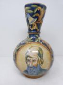 An Italian majolica vase with male and female painted portraits. Two circular panel with an