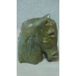 A carved green hard stone horses head sculpture. H.38cm