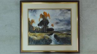 A framed and glazed watercolour and oil painting depicting a river that runs through a field.