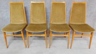 A set of four mid 20th century dining chairs with upholstered backs and seats by Benze Sitzmobil,
