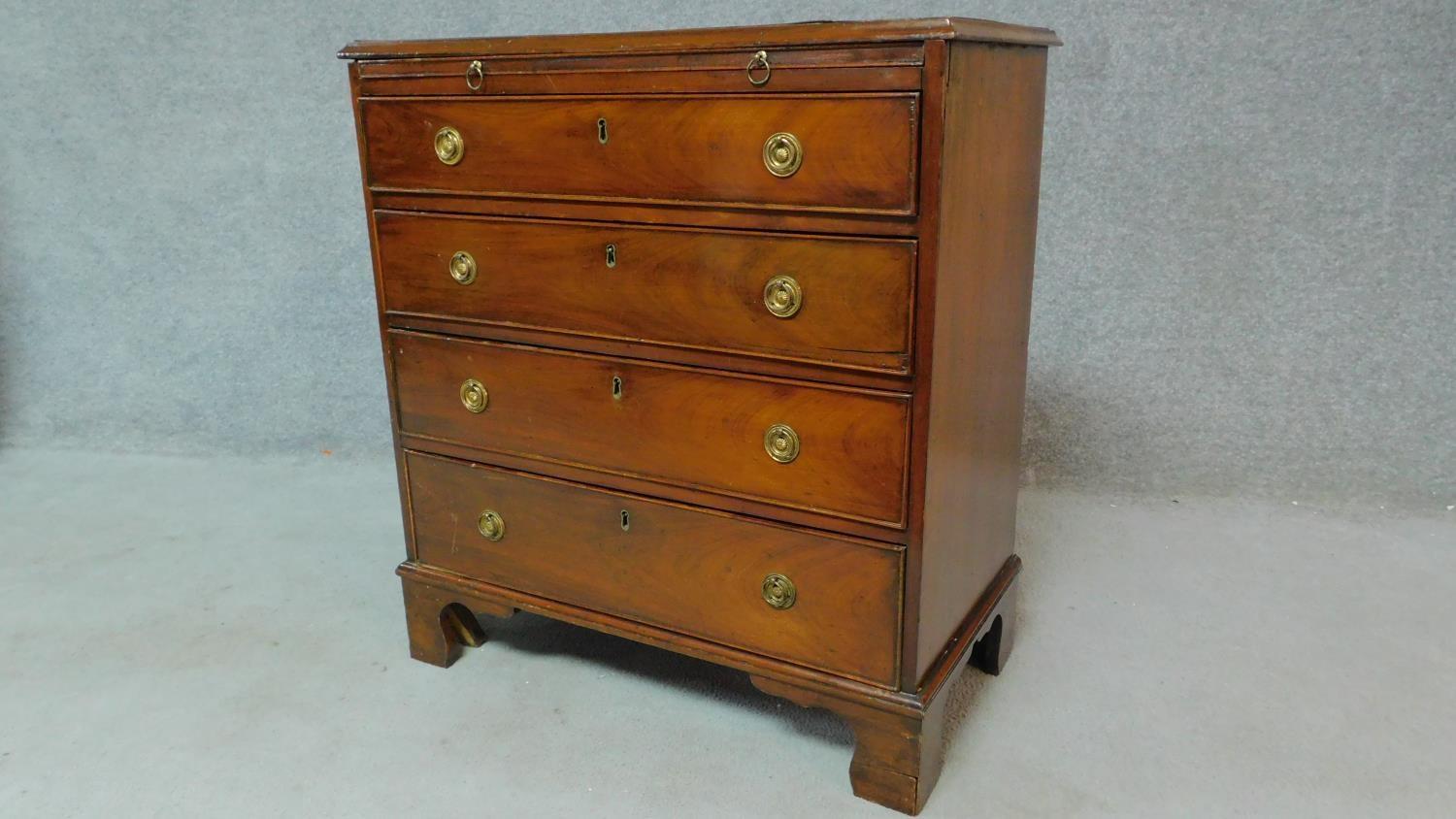 A Georgian mahogany chest of four long drawers fitted with brush slide on bracket feet. H.80 W.74 - Image 2 of 8