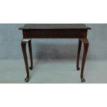 A Georgian mahogany shaped top centre table on cabriole pad foot supports. H.71 W.80 D.40cm