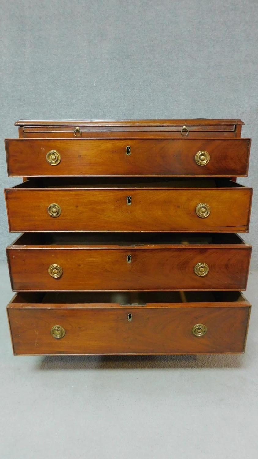 A Georgian mahogany chest of four long drawers fitted with brush slide on bracket feet. H.80 W.74 - Image 3 of 8