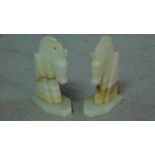 A pair of vintage carved alabaster horse head bookends. H.18cm