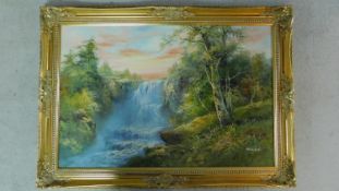 A gilt framed oil on board depicting a waterfall in forest, by R. Darford. 77x107cm