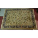 A Kashan style rug, all over spandrel motifs with repeating petal motifs on an ivory field,