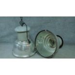 A pair of large vintage industrial spotlights in metal cases. H.80 W.60