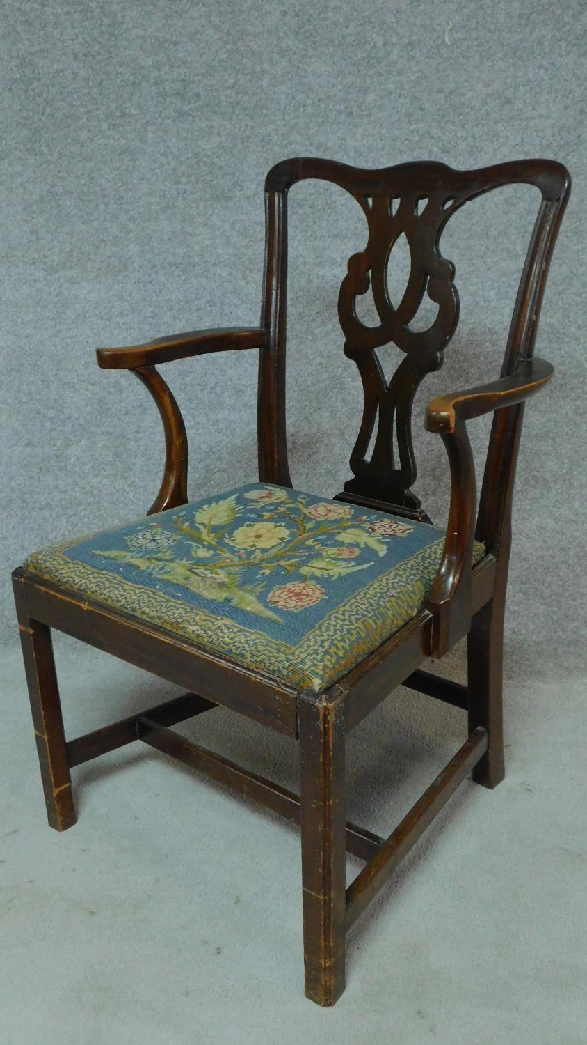 A Georgian mahogany open armchair with drop in tapestry seat on square tapering supports. H.94cm