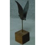 A modern bronze sculpture of a bird on a wooden block base. Bird is removable. H.42cm