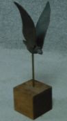 A modern bronze sculpture of a bird on a wooden block base. Bird is removable. H.42cm