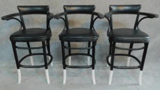 A set of three ebonised bentwood style bar chairs. H.98cm