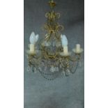 A metal framed six branch chandelier with crystal drops. 47x48cm