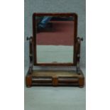 A 19th century mahogany toilet mirror fitted with two frieze drawers. H.70cm