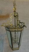 An antique French pierced brass hanging lantern with cross hatched cut glass panels. 60x35cm