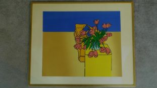 A framed and glazed lithograph depicting flowers in a vase. 65x80cm