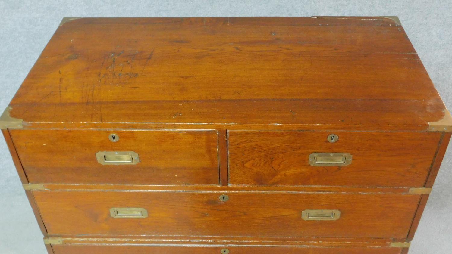 A 19th century teak two part brass bound military campaign chest fitted inset brass handles. H.98 - Image 3 of 7