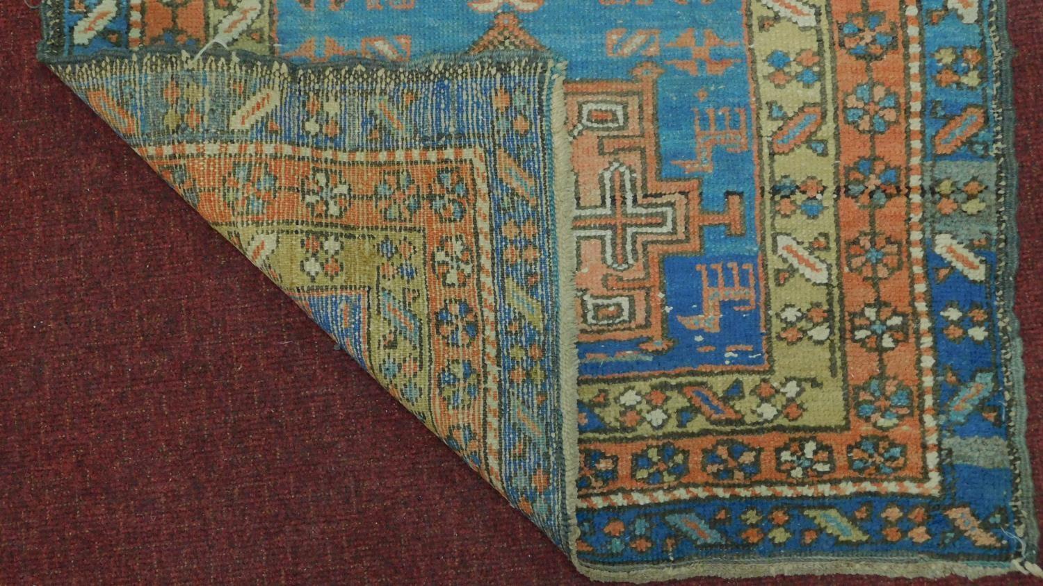 A Persian Heriz style runner, repeating stylised medallion throughout the field guarded by multi - Image 4 of 4
