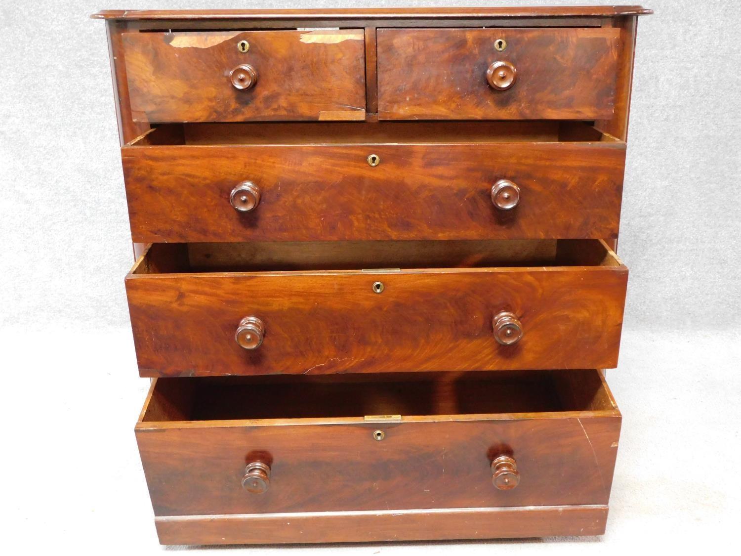 A Victorian mahogany chest of two short over three long drawers, raised on squat turned supports. - Image 3 of 8