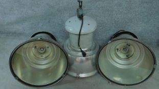 Three large vintage industrial spotlights in metal cases. H.80 W.60cm