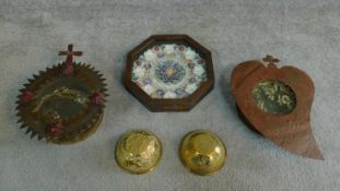 A collection of antique decorative items including two metal framed wax flower crowns, a pair of