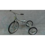 A convertible vintage tricycle designed in 1949 by Tony Anthony, aluminum frame and seat with hard