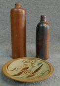 A pair of German and Dutch antique terracotta glazed bottles with embossed maker and seal along with