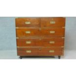 A 19th century teak two part brass bound military campaign chest fitted inset brass handles. H.98