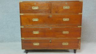 A 19th century teak two part brass bound military campaign chest fitted inset brass handles. H.98