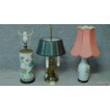 A collection of three vintage lamps, two with oriental vase bases, the other a three branched