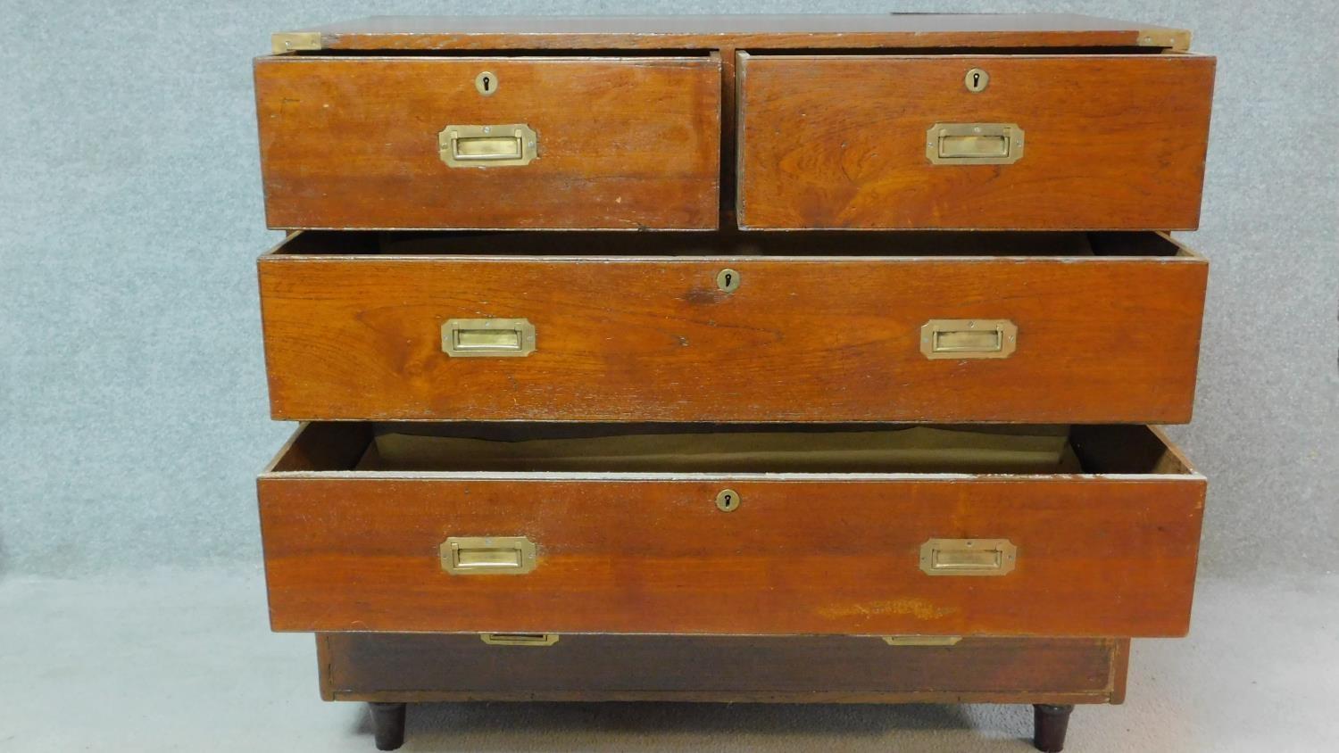 A 19th century teak two part brass bound military campaign chest fitted inset brass handles. H.98 - Image 2 of 7