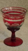 A large ruby cut to clear glass chalice by Laura Ashley. H.19cm