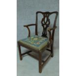 A Georgian mahogany open armchair with drop in tapestry seat on square tapering supports. H.94cm