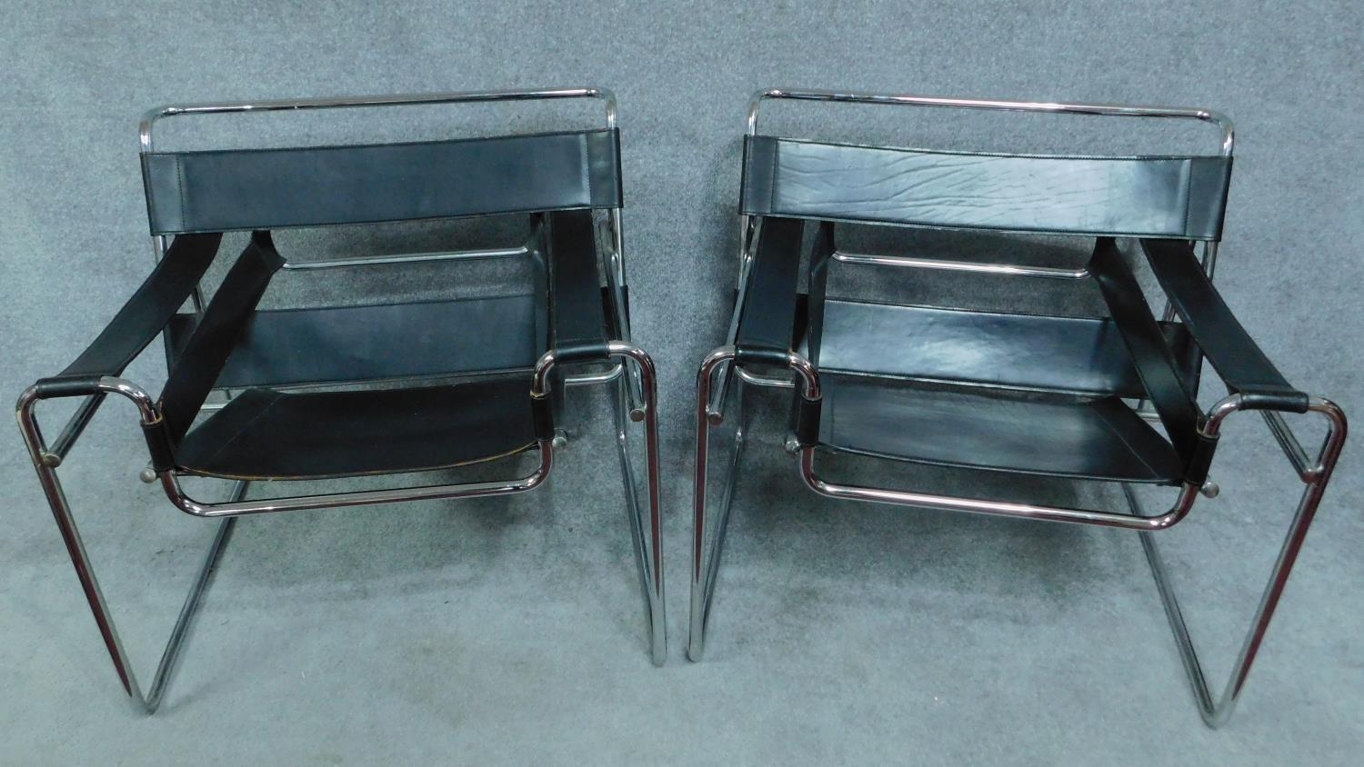 A pair of Vintage Wassily B3 style black leather armchairs on chrome support. H.72cm