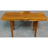 A vintage natural form yew wood bench by Reynolds of Ludlow. H.40 W.74 D.37cm